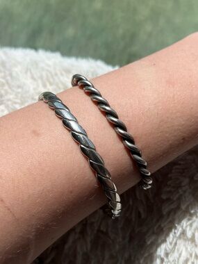 Two Silver Tone Twisted Bracelets